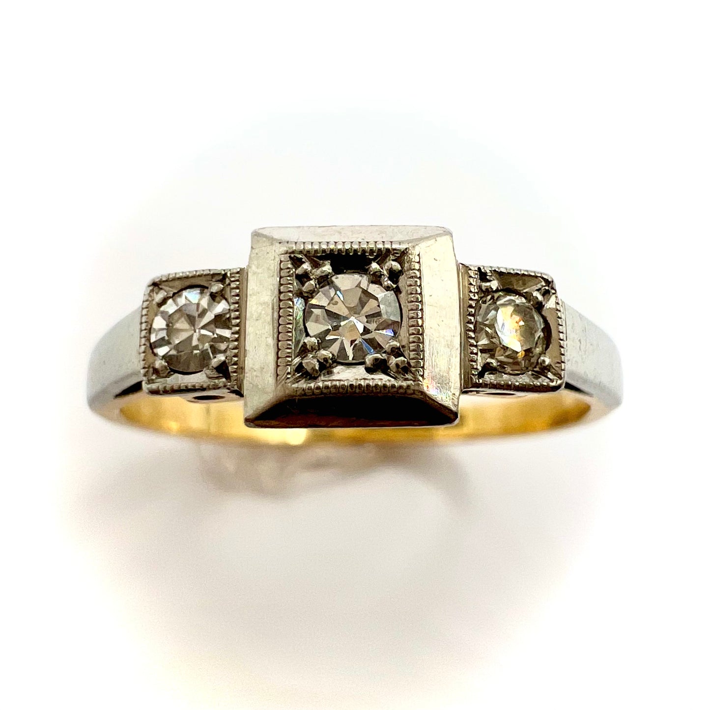 1920s Art Deco Platinum and 18ct gold trilogy engagement ring, size M