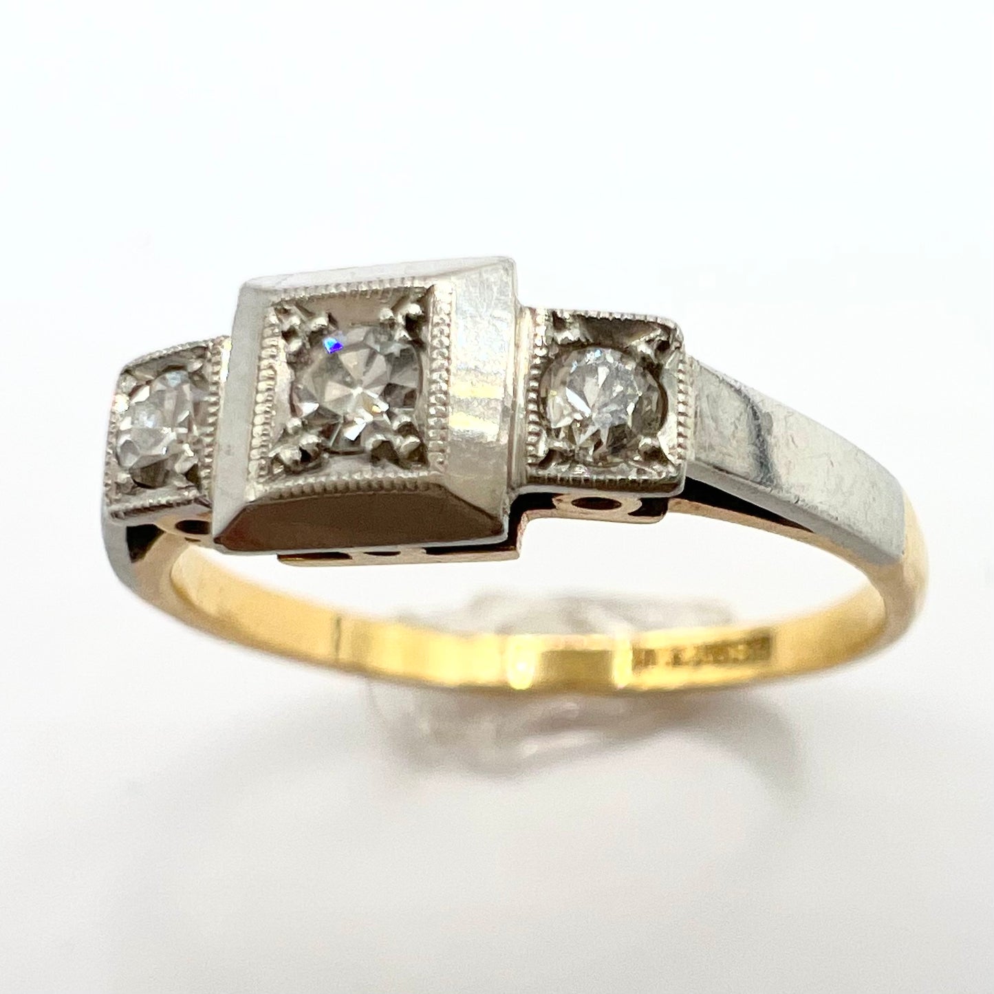 1920s Art Deco Platinum and 18ct gold trilogy engagement ring, size M