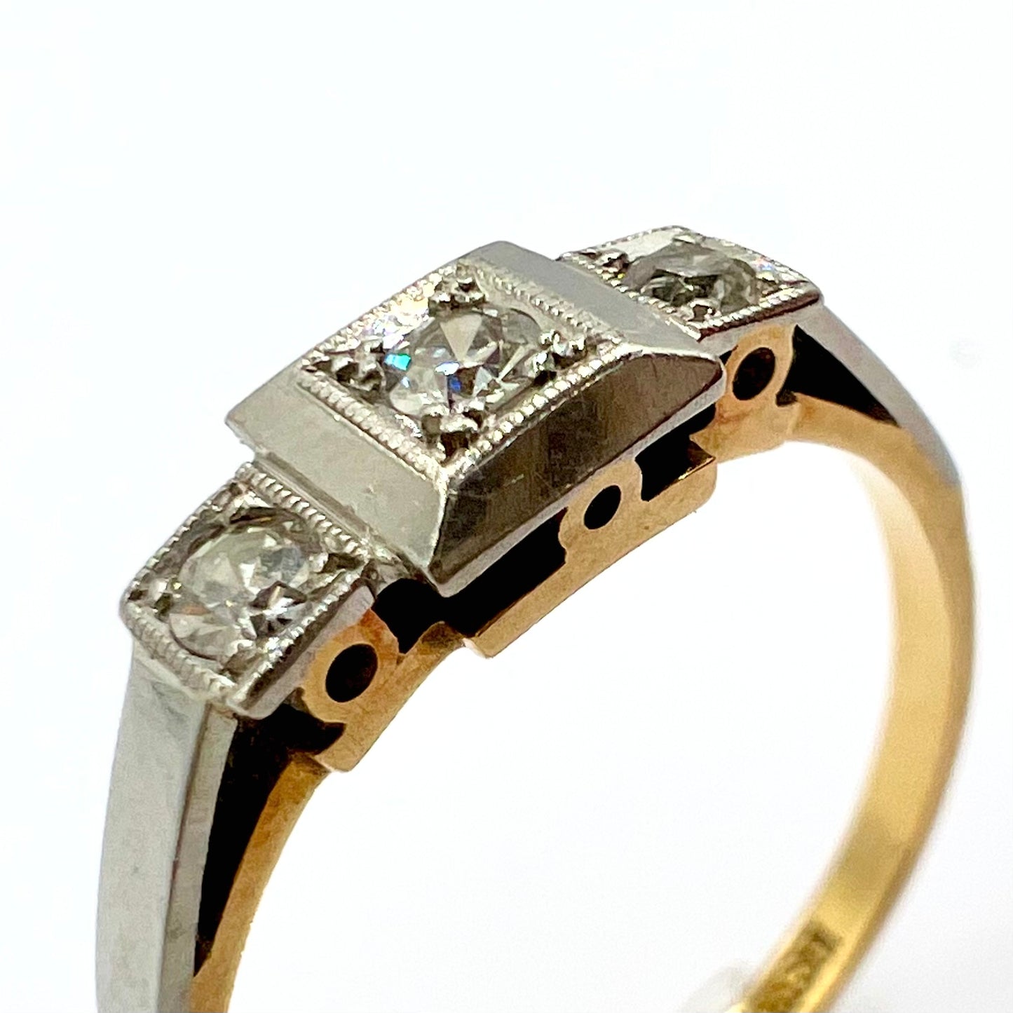 1920s Art Deco Platinum and 18ct gold trilogy engagement ring, size M