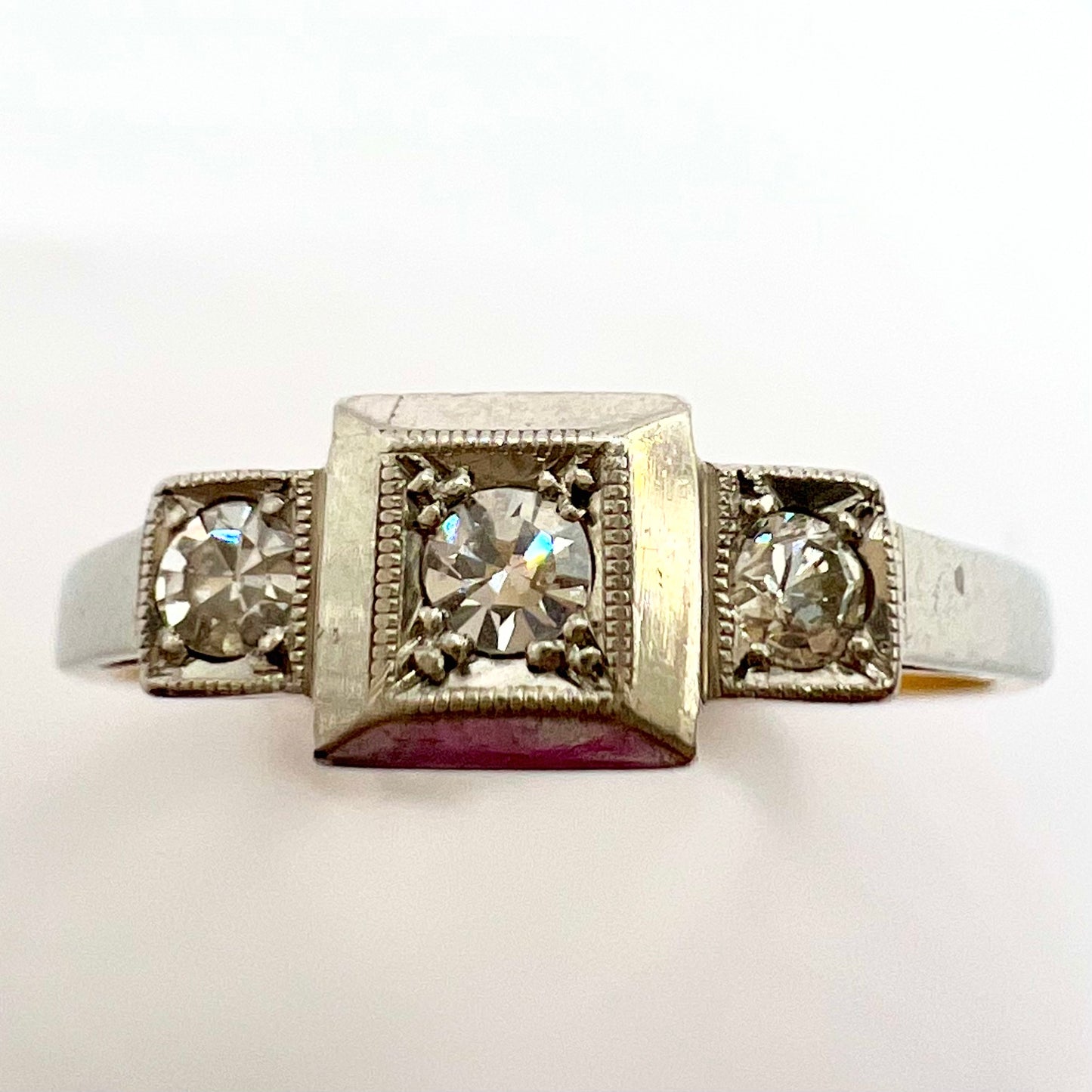 1920s Art Deco Platinum and 18ct gold trilogy engagement ring, size M