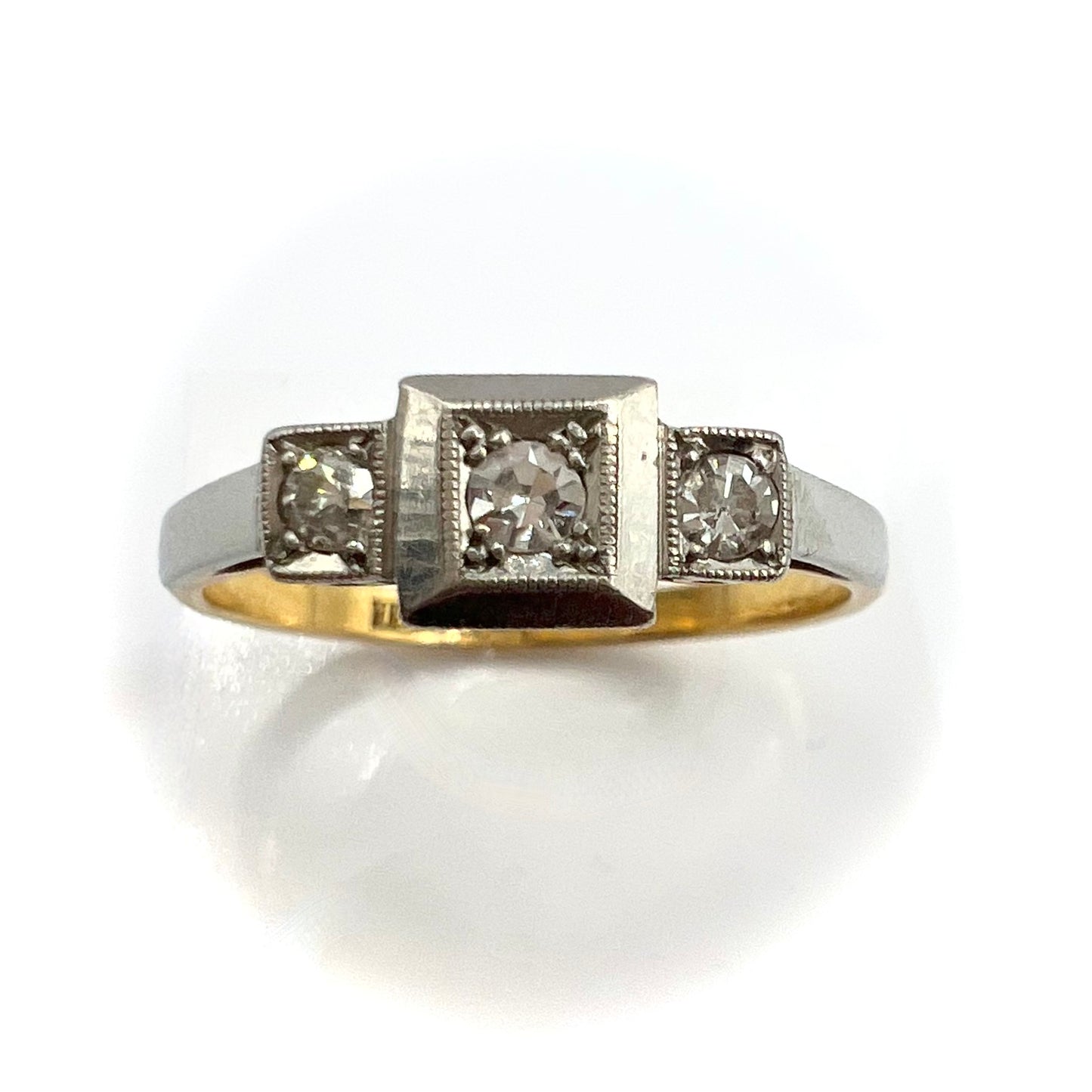 1920s Art Deco Platinum and 18ct gold trilogy engagement ring, size M